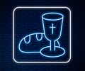 Glowing neon line Goblet and bread icon isolated on brick wall background. Bread and wine cup. Holy communion sign Royalty Free Stock Photo