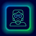 Glowing neon line Hacker or coder icon isolated on black background. Programmer developer working on code, coding Royalty Free Stock Photo