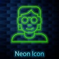 Glowing neon line Hacker or coder icon isolated on brick wall background. Programmer developer working on code, coding
