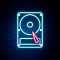 Glowing neon line Hard disk drive HDD icon isolated on brick wall background. Colorful outline concept. Vector Royalty Free Stock Photo