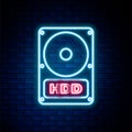 Glowing neon line Hard disk drive HDD icon isolated on brick wall background. Colorful outline concept. Vector Royalty Free Stock Photo