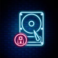 Glowing neon line Hard disk drive and lock icon isolated on brick wall background. HHD and padlock. Security, safety Royalty Free Stock Photo