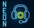 Glowing neon line Headphones icon isolated on black background. Support customer service, hotline, call center, faq Royalty Free Stock Photo