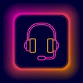 Glowing neon line Headphones icon isolated on black background. Support customer service, hotline, call center, faq