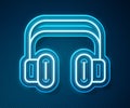 Glowing neon line Headphones icon isolated on blue background. Support customer service, hotline, call center, faq Royalty Free Stock Photo