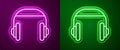 Glowing neon line Headphones icon isolated on purple and green background. Support customer service, hotline, call