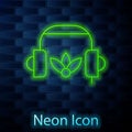 Glowing neon line Headphones for meditation icon isolated on brick wall background. Vector Royalty Free Stock Photo