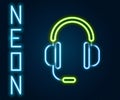 Glowing neon line Headphones with microphone icon isolated on black background. Colorful outline concept. Vector Royalty Free Stock Photo