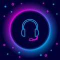Glowing neon line Headphones with microphone icon isolated on black background. Concept object for listening to music Royalty Free Stock Photo