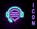 Glowing neon line Headphones with speech bubble chat icon isolated on black background. Support customer service Royalty Free Stock Photo