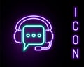 Glowing neon line Headphones with speech bubble icon isolated on black background. Support customer services, hotline Royalty Free Stock Photo