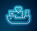 Glowing neon line Humanitarian ship icon isolated on blue background. Vector