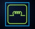 Glowing neon line Inductor in electronic circuit icon isolated on brick wall background. Vector