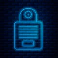 Glowing neon line Intercom icon isolated on brick wall background. Vector