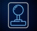 Glowing neon line Joystick for arcade machine icon isolated on brick wall background. Joystick gamepad. Vector