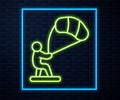 Glowing neon line Kitesurfing icon isolated on brick wall background. Vector Royalty Free Stock Photo