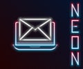 Glowing neon line Laptop with envelope and open email on screen icon isolated on black background. Email marketing Royalty Free Stock Photo