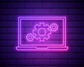 Glowing neon line Laptop and gear icon isolated on brick wall background. Laptop service concept. Adjusting app, setting Royalty Free Stock Photo