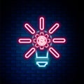 Glowing neon line Light bulb with gear inside and dollar symbol icon isolated on brick wall background. Fintech Royalty Free Stock Photo