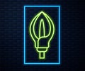 Glowing neon line Lily flower icon isolated on brick wall background. Vector