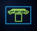 Glowing neon line Luxury limousine car and carpet icon isolated on brick wall background. For world premiere celebrities