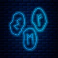 Glowing neon line Magic runes icon isolated on brick wall background. Vector