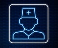 Glowing neon line Male doctor icon isolated on brick wall background. Vector