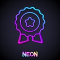 Glowing neon line Medal with star icon isolated on black background. Winner symbol. Vector