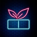 Glowing neon line Medical pill with plant icon isolated on brick wall background. Herbal pill. Colorful outline concept