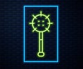 Glowing neon line Medieval chained mace ball icon isolated on brick wall background. Medieval weapon. Vector