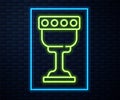 Glowing neon line Medieval goblet icon isolated on brick wall background. Holy grail. Vector Royalty Free Stock Photo