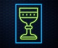 Glowing neon line Medieval goblet icon isolated on brick wall background. Vector Royalty Free Stock Photo