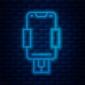 Glowing neon line Mobile phone holder icon isolated on brick wall background. Vector Royalty Free Stock Photo