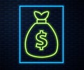 Glowing neon line Money bag icon isolated on brick wall background. Dollar or USD symbol. Cash Banking currency sign