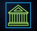 Glowing neon line Museum building icon isolated on brick wall background. Vector