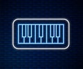 Glowing neon line Music synthesizer icon isolated on brick wall background. Electronic piano. Vector Royalty Free Stock Photo