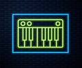 Glowing neon line Music synthesizer icon isolated on brick wall background. Electronic piano. Vector Illustration Royalty Free Stock Photo