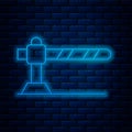 Glowing neon line Parking car barrier icon isolated on brick wall background. Street road stop border. Vector