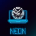 Glowing neon line Percent symbol discount and laptop icon isolated on black background. Sale percentage - price label Royalty Free Stock Photo