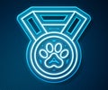 Glowing neon line Pet award symbol icon isolated on blue background. Badge with dog or cat paw print and ribbons. Medal Royalty Free Stock Photo