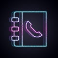 Glowing neon line Phone book icon isolated on black background. Address book. Telephone directory. Vector