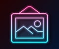 Glowing neon line Picture landscape icon isolated on black background. Vector
