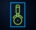 Glowing neon line Pizza knife icon isolated on brick wall background. Pizza cutter sign. Steel kitchenware equipment