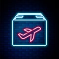 Glowing neon line Plane and cardboard box icon isolated on brick wall background. Delivery, transportation. Cargo Royalty Free Stock Photo