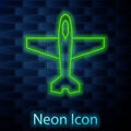 Glowing neon line Plane icon isolated on brick wall background. Flying airplane icon. Airliner sign. Vector Royalty Free Stock Photo