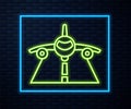 Glowing neon line Plane icon isolated on brick wall background. Flying airplane icon. Airliner sign. Vector Royalty Free Stock Photo