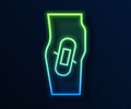 Glowing neon line Plaster on leg icon isolated on blue background. Vector