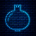 Glowing neon line Pomegranate icon isolated on brick wall background. Garnet fruit. Vector