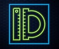 Glowing neon line Protractor grid for measuring degrees icon isolated on brick wall background. Tilt angle meter Royalty Free Stock Photo