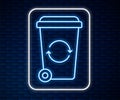 Glowing neon line Recycle bin with recycle symbol icon isolated on brick wall background. Trash can icon. Garbage bin